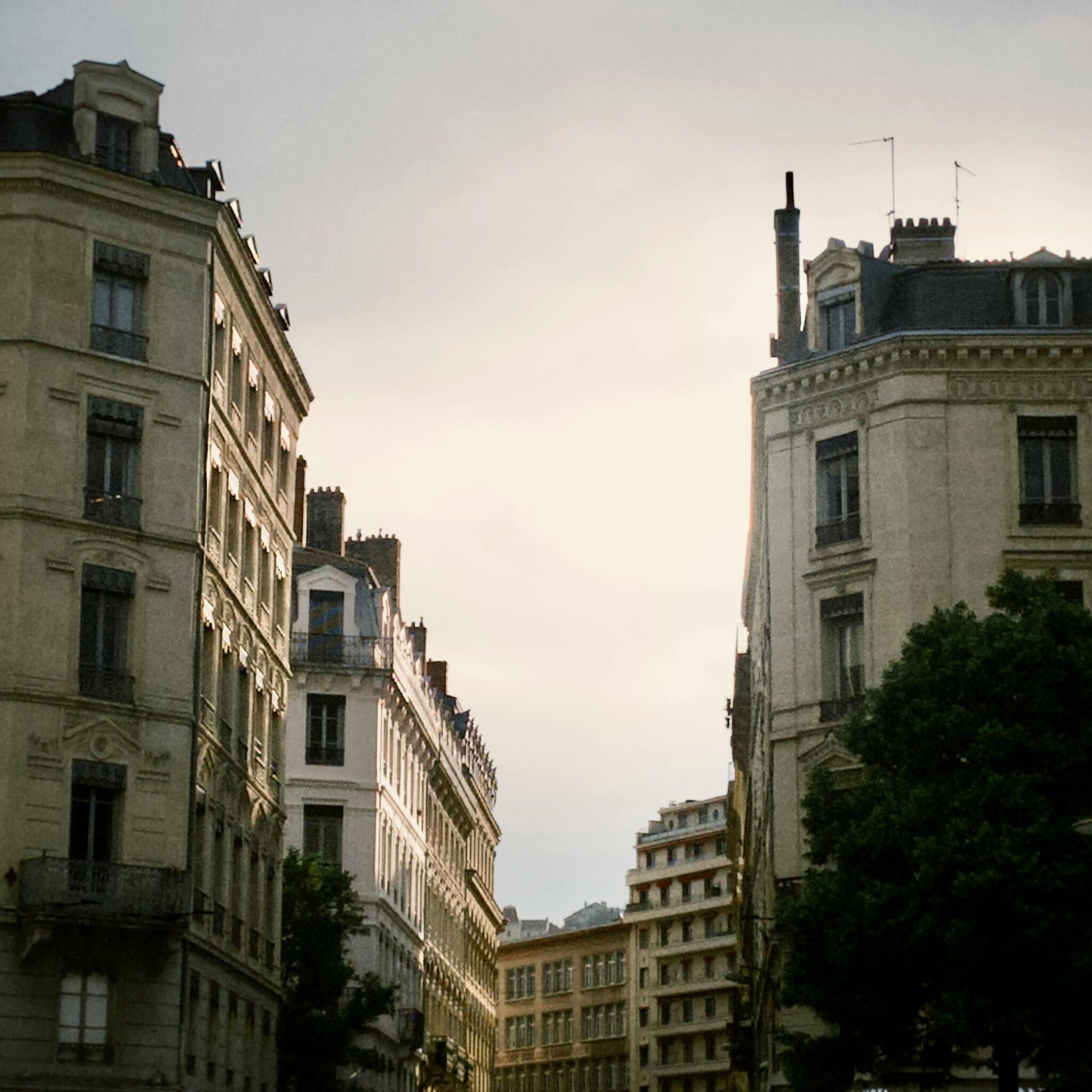 Street photography of European buildings shot with Daydream camera app showing authentic film grain and vintage colors